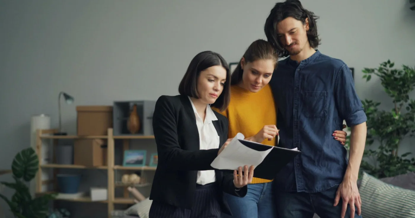 Couple reviewing a document with an adviser